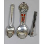 A Danish silver caddy spoon chased to the trefoil terminal with a long boat and enamelled with the