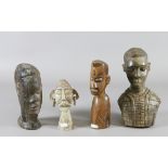 Four carved African busts.