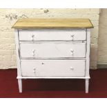 A painted and distressed three high chest of drawers.