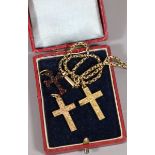 A Victorian 9 carat gold cross on chain 9.