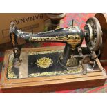 A mahogany cased Singer sewing machine.