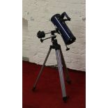 A Tasco Galaxsee Star Gazers telescope on tripod stand.