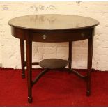 An Edwardian mahogany circular two tier single drawer window table raised on square tapering