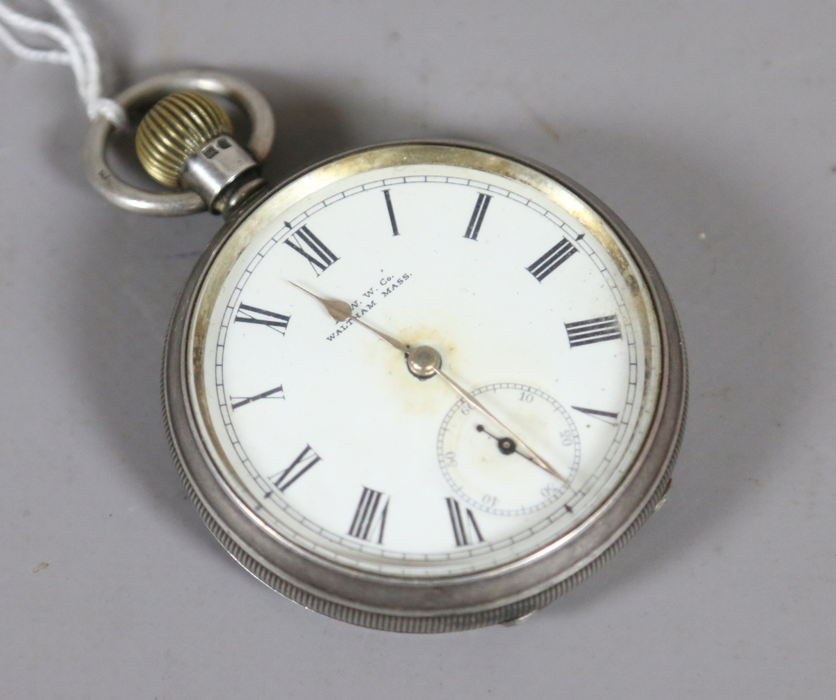 A silver cased Waltham pocket watch with enamel dial and subsidiary seconds,