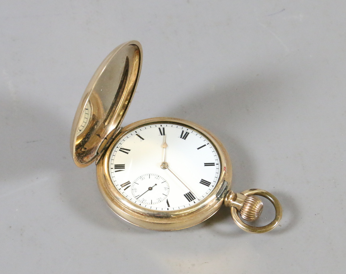 A gentlemens gold plated hunter pocket watch with enamel face and subsidiary dial.