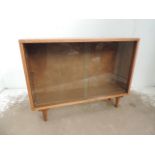 Low Teak Bookcase with Sliding Glass Door on Short Legs