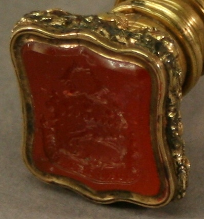 A 19TH CENTURY GLASS, GILT METAL AND CARNELIAN SEAL with facet-cut glass handle, yellow metal - Image 2 of 2