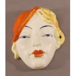 A BESWICK ART DECO POTTERY WALL MASK, a blonde woman wearing an orange beret, impressed, printed and
