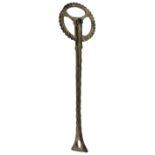 A 19TH CENTURY CAST COPPER-ALLOY PASTRY JIGGER with three-spoked wheel, the stem cast with formal