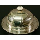 A GEORGE V SILVER MUFFIN DISH the circular domed cover with ivory finial and fluted decoration,