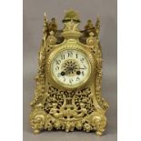 AN ORNATE FRENCH GILT METAL BRACKET CLOCK of spreading square section form, cast and pierced