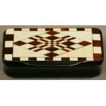 A 19TH CENTURY INLAID HORN SNUFF BOX of hinged rectangular form, the cover inlaid with bone and