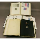 A GROUP OF FOUR STAMP ALBUMS various GB stamps including two penny blacks ( L & D). (qty)