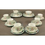 A GROUP OF TWENTY TWO 'GLASGOW GIRLS' DECORATED TEA WARES by Ann Macbeth, comprising six cups, six