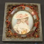 A 19TH CENTURY BOULLE FRAMED PORTRAIT MINIATURE of oval form, watercolours on ivory panel, depicting