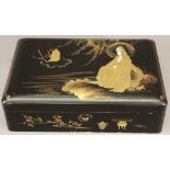 AN EARLY 20TH CENTURY JAPANESE LACQUERED BOX lacquered in gilt and inset with ivory, a seated figure