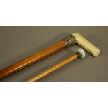 A VICTORIAN IVORY HANDLED MALACCA WALKING CANE, with embossed silver mount 93cm(L); also a ladies