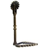 A 19TH CENTURY BRASS PASTRY JIGGER with wheel and leaf- or tree-form cutter, 10.9cm long. CONDITION: