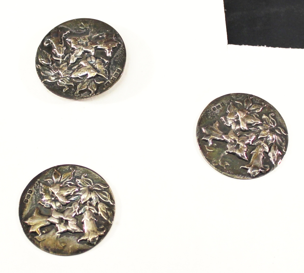 THREE EDWARDIAN SILVER BUTTONS of circular form embossed with foliate decoration, marks for