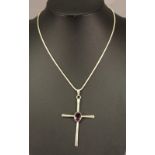 A SILVER AMETHYST SET CROSS PENDANT with central oval-cut amethyst, suspended by a multi-linked