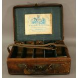 A WILLIAMS & POWELL (LIVERPOOL) STITCHED-LEATHER CARTRIDGE CASE with applied paper maker's label and