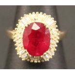 A 14K YELLOW GOLD AND DIAMOND RING set with an oval cut ruby 5.40ct, diamonds approx 1.10ct. Ring