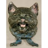 A COLD-PAINTED BRONZE INKWELL in the form of a cat's head, unmarked. 9cm x 11cm CONDITION: Split