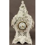 A LARGE FIGURAL MEISSEN TYPE BLANC DE CHINE MANTEL CLOCK surmounted with a shepherdess and sheep