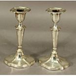 PAIR OF EARLY 20TH CENTURY SILVER CANDLESTICKS in the Neo Classical taste, marks for Sheffield,