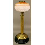 A VICTORIAN BRASS AND GLASS COLUMN OIL LAMP having a tinted globular shade, brass burner and moulded