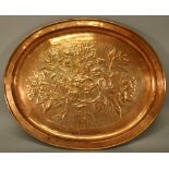 A KESWICK SCHOOL OF INDUSTRIAL ART (KSIA) COPPER TRAY of shallow dished oval form with rolled rim,