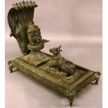 AN INDIAN BRONZE SHIVA LINGAM with Naag umbrella over the Shiva mask lingam facing a recumbent Nandi