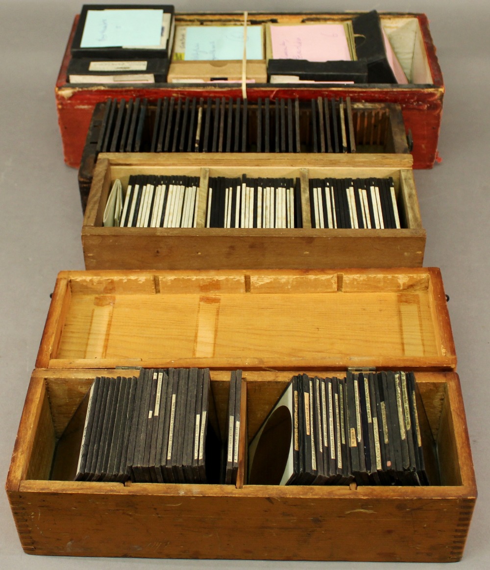 A COLLECTION OF GLASS LANTERN SLIDES approximately 250, housed in wooden boxes, various topics