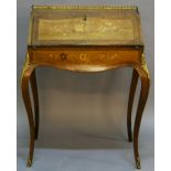 A LATE 19TH CENTURY FRENCH MARQUETRY INLAID AND GILT METAL-MOUNTED WALNUT BUREAU DE DAME having a