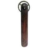 A LATE 18TH/EARLY 19TH CENTURY PASTRY JIGGER with three-spoked brass wheel and simple oak handle,