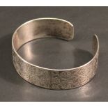 A MODERN SCOTTISH SILVER BANGLE of open form moulded with Celtic designs, marks for Edinburgh