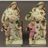 A PAIR OF 19TH CENTURY STAFFORDSHIRE POTTERY FIGURES depicting a mother and three young children, on