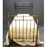A VICTORIAN BRASS SINGLE BED of typical brass pole construction, the ends linked by iron rails, with