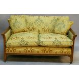 A MAHOGANY-FRAMED THREE PIECE SUITE comprising a two seater settee and two armchairs, each with