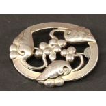 A GEORG JENSEN 925 STERLING BROOCH of oval form moulded and pierced with fruiting foliage, number