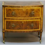 A 19TH CENTURY MAHOGANY BOW-FRONTED CHEST OF DRAWERS having a crossbanded top and two crossbanded