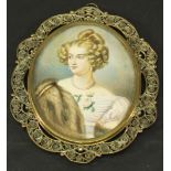 A 19TH CENTURY PORTRAIT MINIATURE of oval form, watercolours on ivory panel depicting a young lady