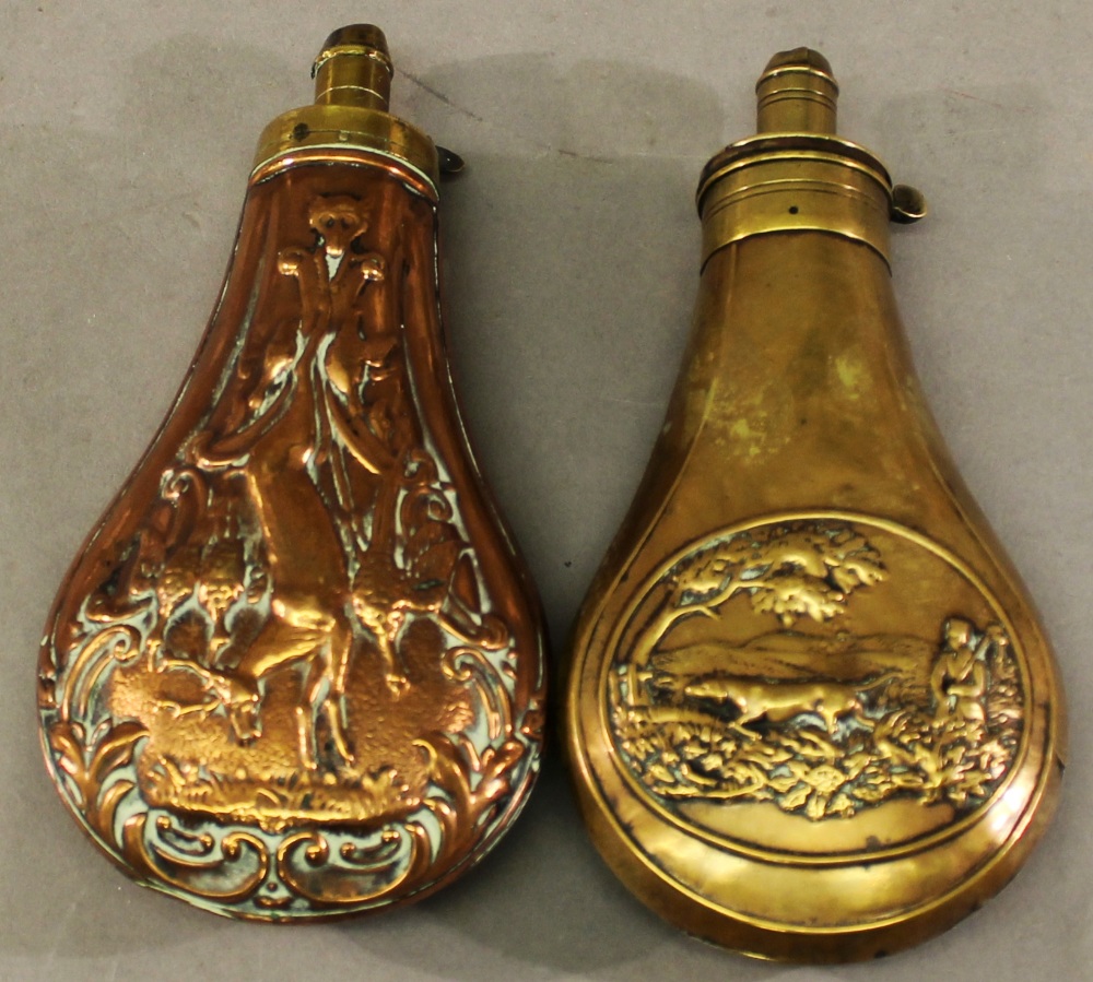 TWO 19TH CENTURY POWDER FLASKS one brass and copper, the other brass, of typical form each with