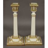 A PAIR OF VICTORIAN ROYAL WORCESTER CANDLESTICKS of Neo Classical column form with gilt