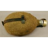 A WW1 GERMAN WATER BOTTLE with leather strap CONDITION: Two patches worn through to metal, leather