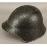 A WW2 ERA DUTCH HELMET painted black having leather liner to interior.  CONDITION: Some losses to