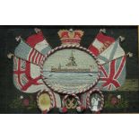 AN EARLY 20TH CENTURY WOOLWORK EMBROIDERY of HMS DREADNOUGHT within a crowned rope border and flag