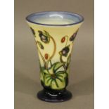A MOORCROFT POTTERY 'HEPATICA' PATTERNED VASE of flared cylindrical form, tube-lined with flowers