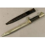 A GERMAN WW2 PARADE BAYONET held within scabbard, marked to blade "Original Eickhorn, Solingen".