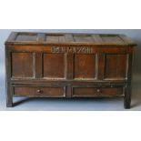 AN 18TH CENTURY OAK MULE CHEST having an oblong four-panelled top, internal storage,  a frieze